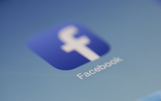Home Close-up view of the Facebook app logo on a digital screen with blurred background.